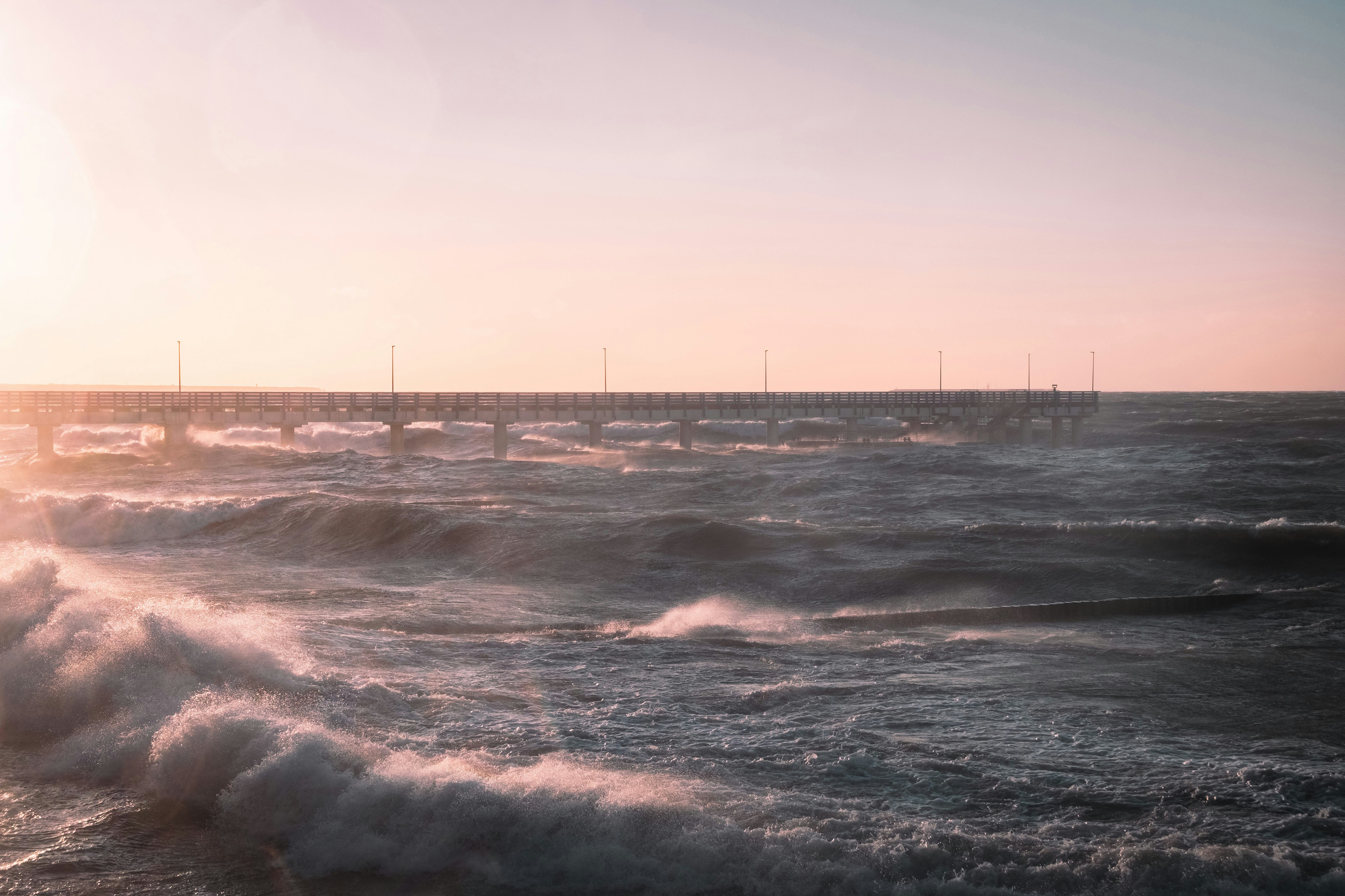 sea waves crashing on shore during daytime